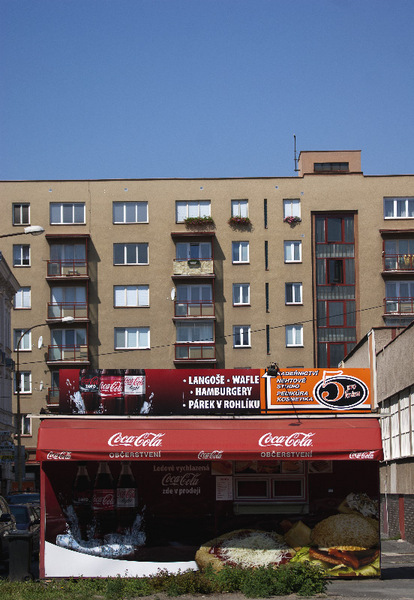 Plzen Czech Republic Coca-Cola diner in front of old apartments.