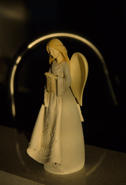 May 15  The angel statue captures my attention again, this time in the warm light of morning that creates a reflective halo of sorts from the kitchen faucet.  Simple beauty found simply.