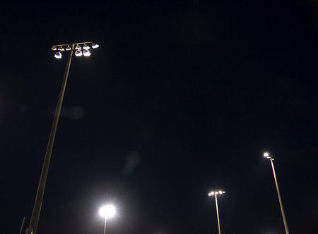 Little league lights at night.