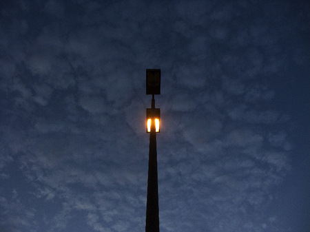 Parking lot light pole at twilight.