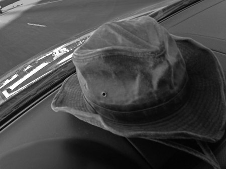 March 5, 2015:  I had to resort to a photo created with my phone while driving to a photo group for which I review images.  There, on the tollway, my hat caught my attention...a bit used, a bit worse for wear, but a whole lot of comfortable.  Not just my hat, but me too.  Still...life.