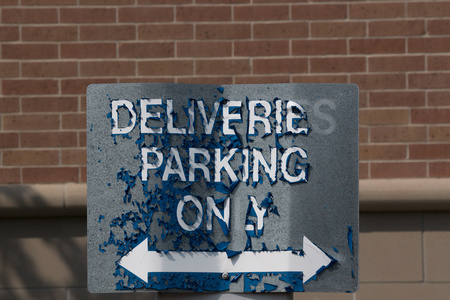 August 27, 2015:  Old and weathered--once a shiny new, blue sign standing starkly against the red brick backdrop--she still serves her role and service.  Duty before appearance.  Still...life.