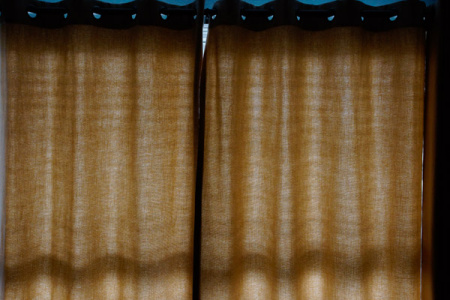 May 3  Warm morning light accentuates with textures and shadows the material of the drapes. I love light and shadows.
