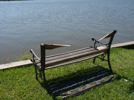 Well worn bench at Hidden Lakes near League City, TX
