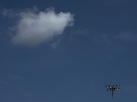 Light pole and cloud.