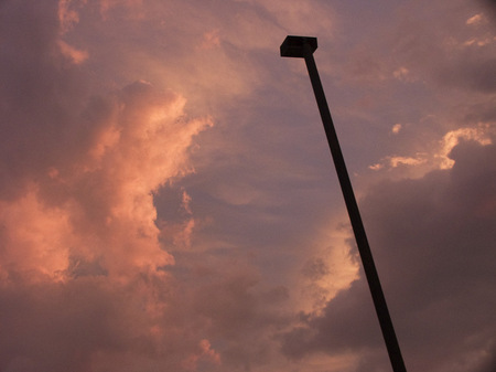 Parking lot light pole at sunset.