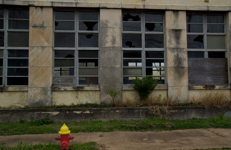 February 23, 2015: It looks rundown and decrepit, but is surely a treasure trove of stories.  People are that way, too.  The bright hydrant calls for attention in front of a building that no one pays attention to anymore.  People are that way, too.  Pay attention.  Still...life.