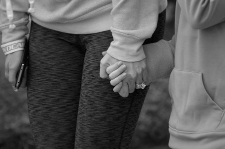 April 4, 2015:  Mother and daughter holding hands before a fun run; the community holding hands to raise money for a food bank.  Holding hands makes the world better.  Still...life.