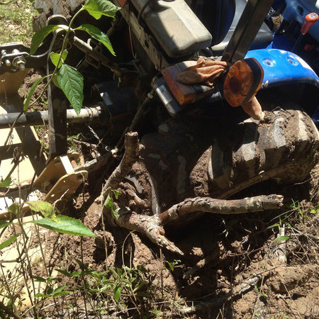 May 4, 2015:  The unseen labyrinth of mole or gopher tunnels, combined with a wet month created an unseen trap.  The tractor found it.  Watching for the unseen can be one of life's great challenges.  Still...life.