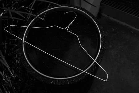 August 18, 2015:  A coat hanger discarded in an ash tray provided everything I needed in the moment to see.  Simple is good.  Still....life.