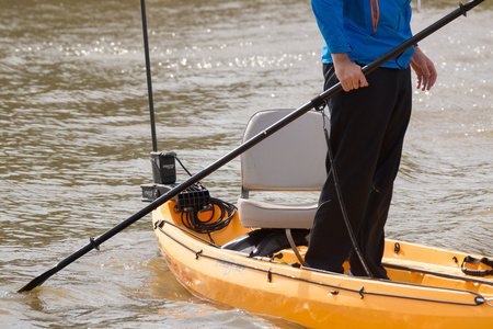 November 11, 2015:  A dozen years ago I photographed him spitting over the pier railing, bored with fishing.  Today, he is accomplished and loving life associated with fishing.  This image from a session for a kayaking magazine...my how they grow up.  Still...life.