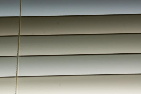 March 6    I envisioned this as a black-and-white image, but when I opened the file and saw the colors of light on the blinds...sometimes beauty means looking at it for what it is, not what you think it is.