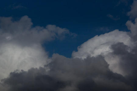 March 7   Black, gray and white cloud waves roll in front of the seamless blue sky...beautiful.  Time to pause in the driveway before driving off.