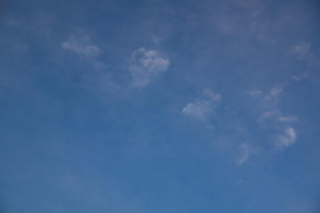 March 27  Subtle whites of barely-there clouds against a blue seamless background.  Beautiful view from the front porch (or anywhere).