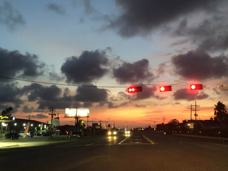 August 8  Galveston sunset stands bold and beautiful.  Luckily the light cooperated so I could stop and grab the image. As bold as the artificial lighting is, it is no match to nature's.