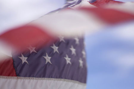 November 12  I think our flag is beautiful. It appears in many of my photo projects. Today, whipping in the cold North winds, she seemed particularly spry and lovely.